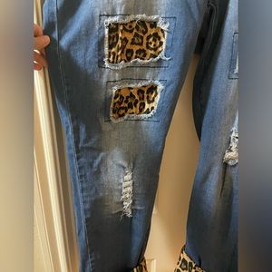 Distressed jeans with leopard fabric inserts size 22